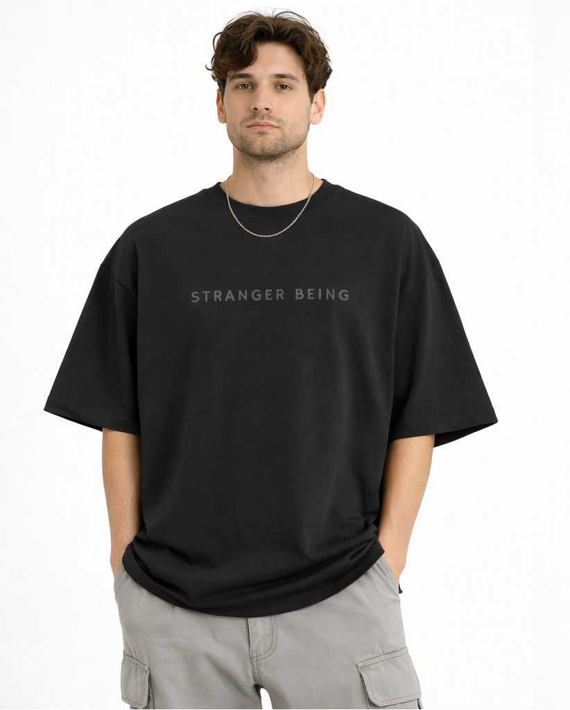Model wearing black Stranger Things inspired streetwear t-shirt with bold graphic print