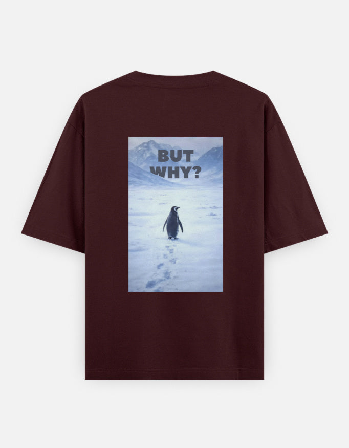 Back view of a maroon t-shirt featuring a rectangular graphic of a lone penguin walking across a snowy Antarctic landscape toward mountains with the text "BUT WHY?" in bold grey letters.